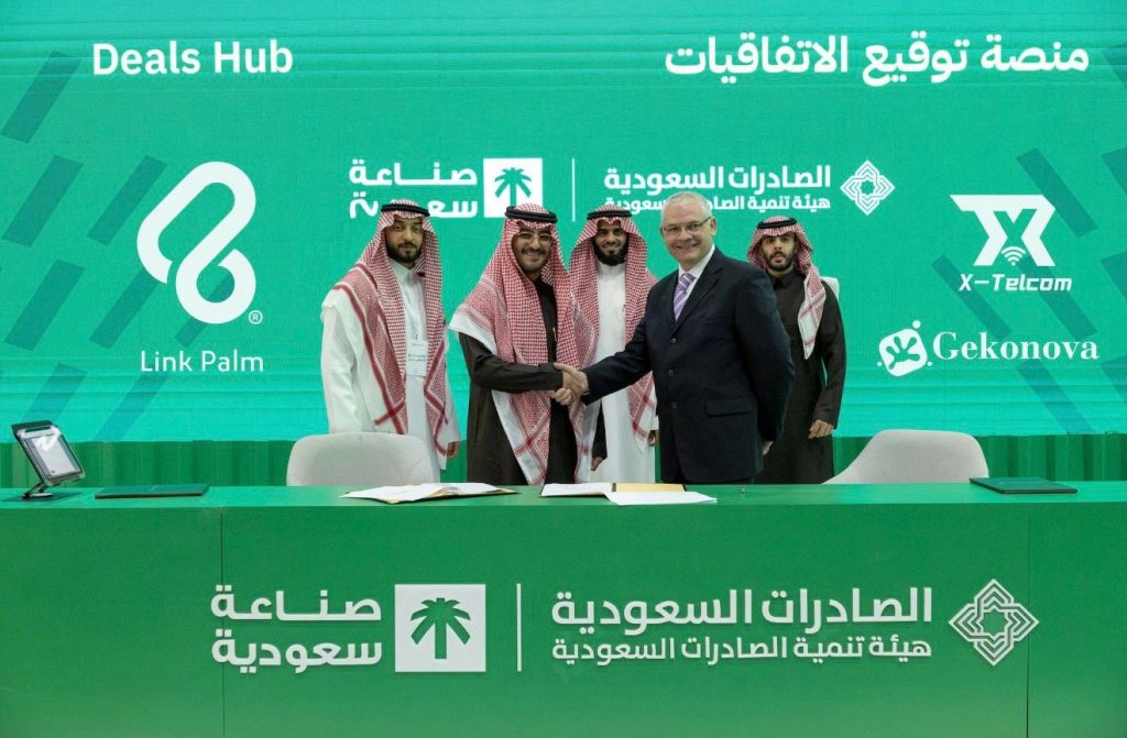 Gekonova and X-Telcom executives shaking hands with NovaPay representatives during the official partnership signing at the Made in Saudi event in Riyadh, marking a major palm vein payment agreement.